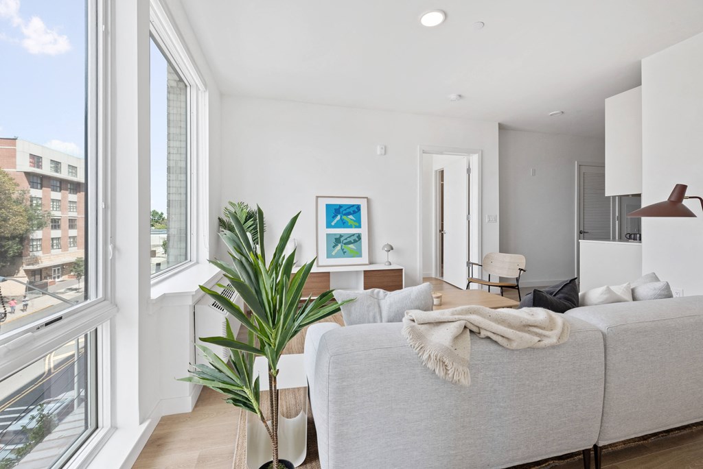 a living room with a couch and a large window