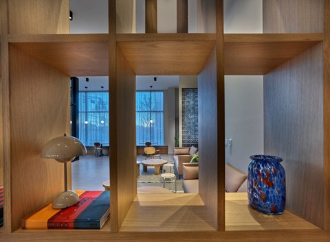 a view of the living room from behind a wall of wood dividers