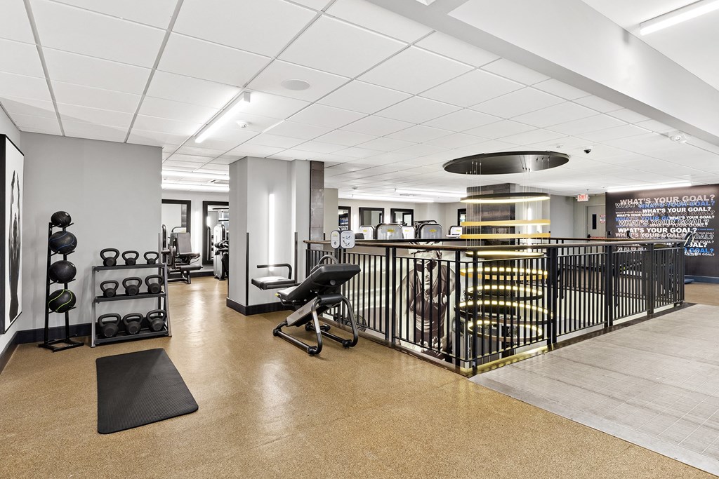 a workout room with weights and other exercise equipment