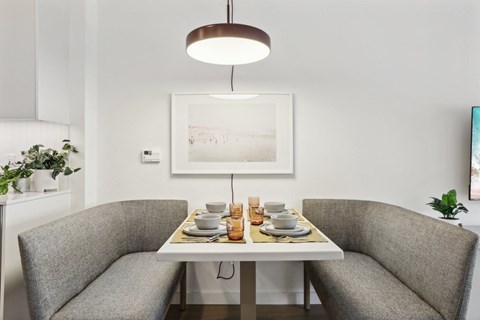 a small dining room with a table and two chairs