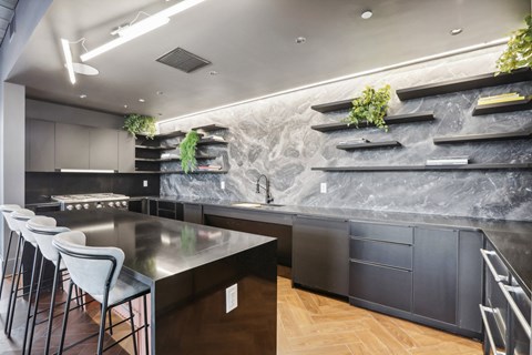 a kitchen with stainless steel counter tops and black