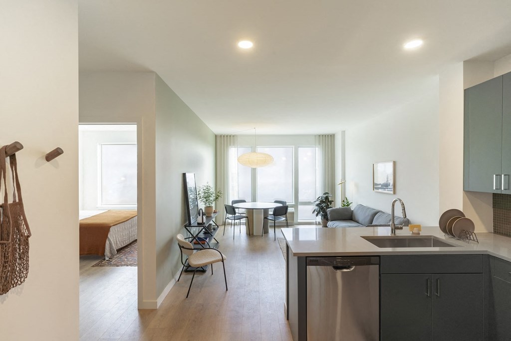 a kitchen and living area in a 555 waverly unit