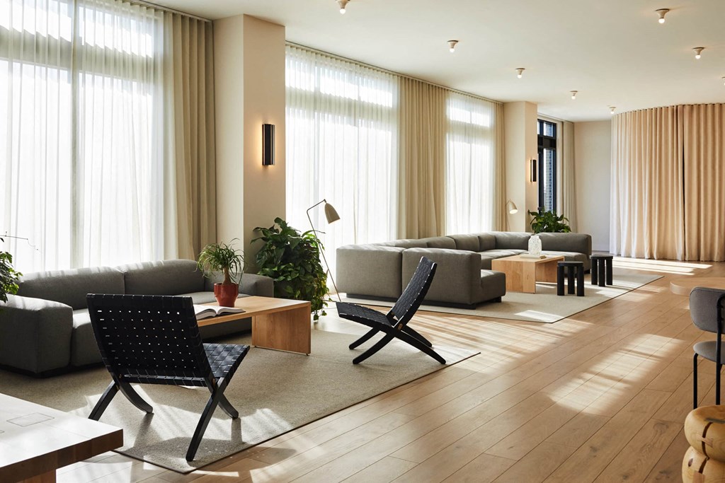 a living room filled with furniture and a large window