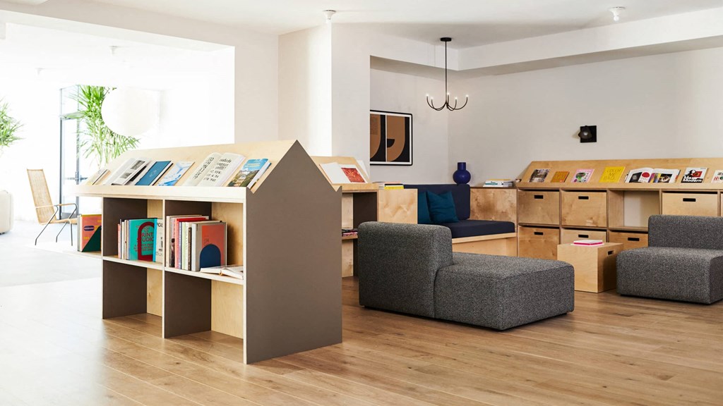 a room filled with furniture and a large window