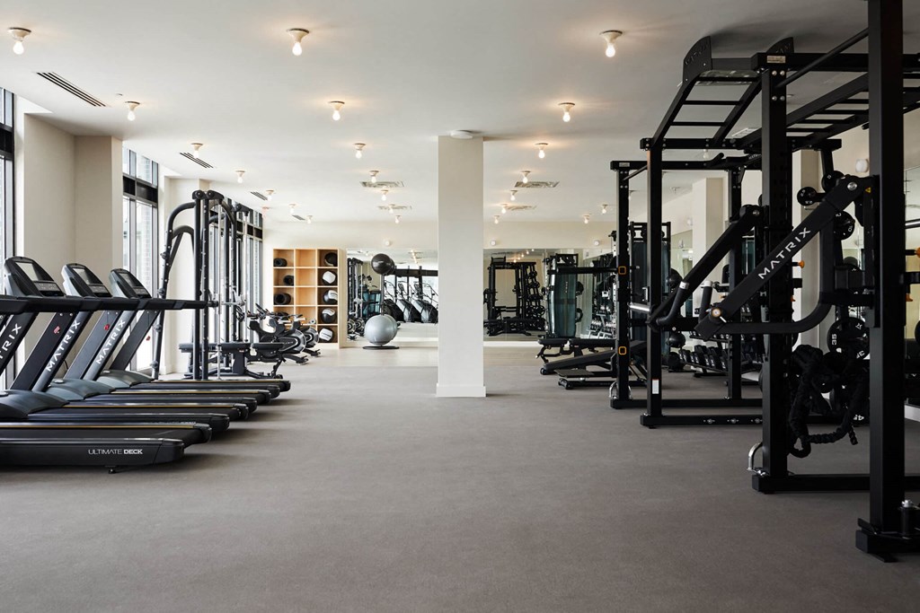 a gym with treadmills and other exercise equipment