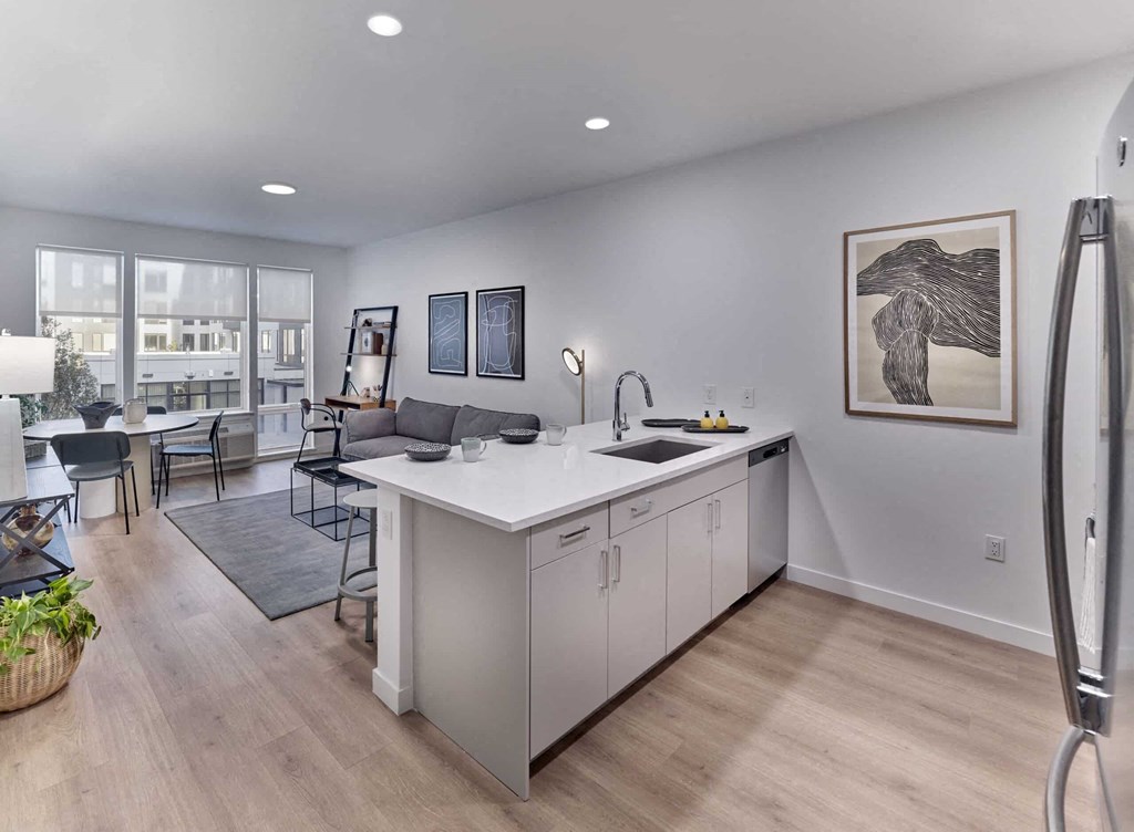 a kitchen and living room in a 555 waverly unit