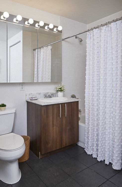 a bathroom with a toilet sink and bathtub
