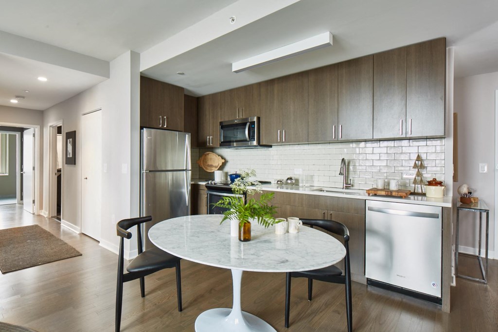 a kitchen and dining area in a 555 waverly unit