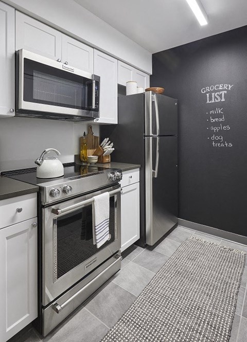 a kitchen with a stove and a refrigerator