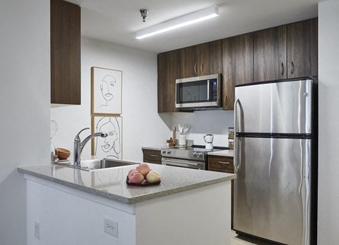 a kitchen with a sink and a refrigerator