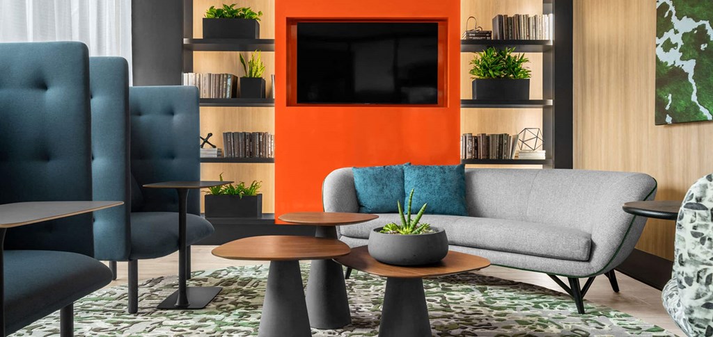 a room filled with furniture and a flat screen tv