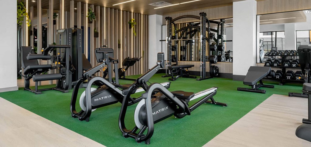 a gym with treadmills and other exercise equipment