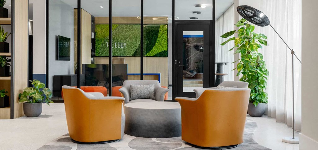 a room filled with furniture and a large window