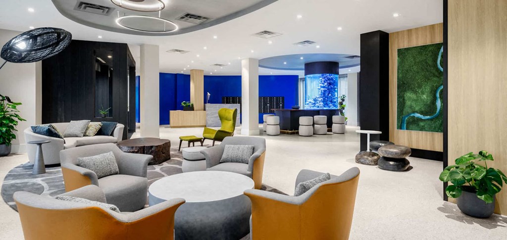 a lobby with couches chairs and tables