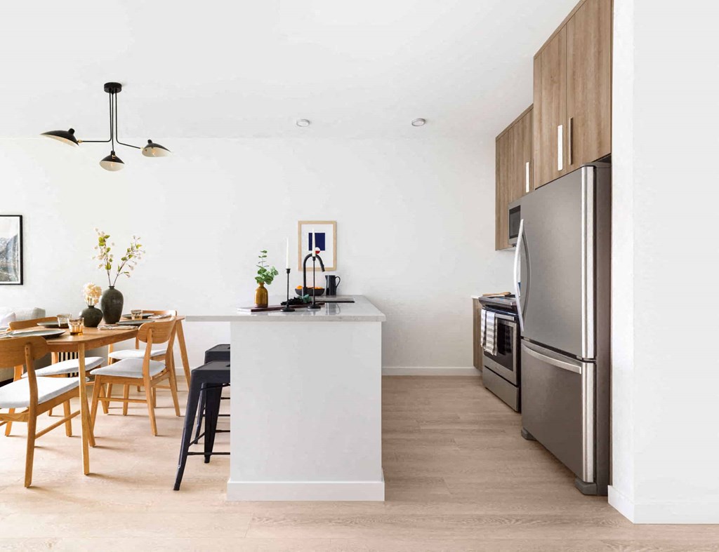 a kitchen and dining area in a 555 waverly unit