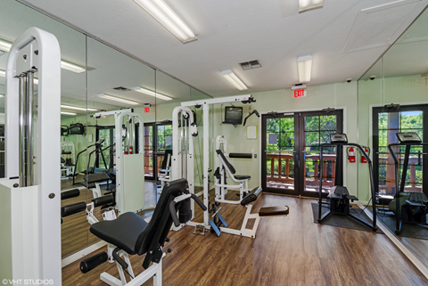 Fitness center with strength and conditioning equipment and large windows for natural lighting