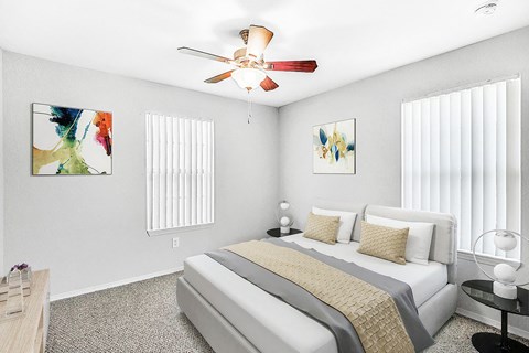 Furnished bedroom with bed and nightstand.