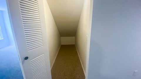 long storage closet with single folding door