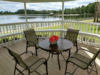 a gazebo with a table and chairs