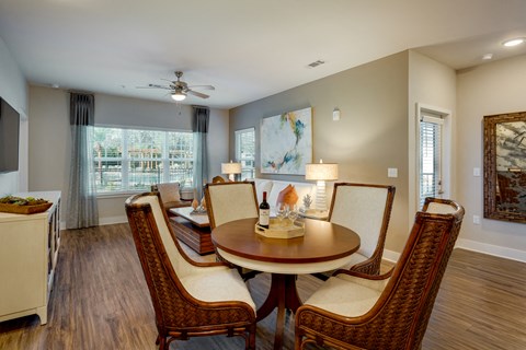 a dining room with a table and chairs