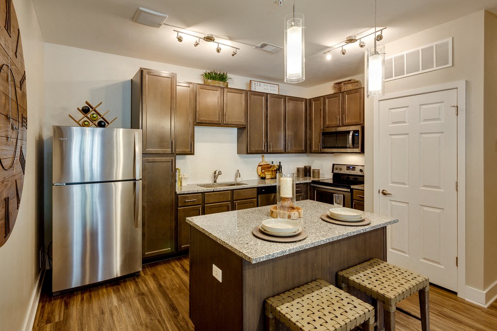 a kitchen with stainless steel appliances and a granite counter top