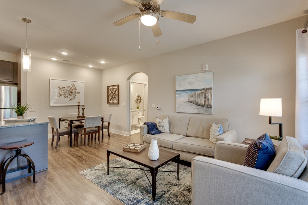 a living room and dining room with a couch and a table