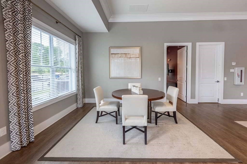 A dining room with a table and chairs at Foxwood Apartments, Raleigh-Durham, NC