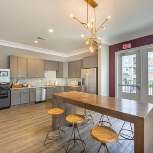 A kitchen with a bar area and a wooden counter at Foxwood Apartments, North Carolina, 27616