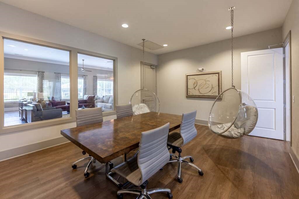A conference room with a long table and chairs at Foxwood Apartments, North Carolina, 27616