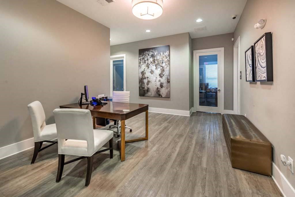 A dining room with a wooden table and chairs at Foxwood Apartments, Raleigh-Durham