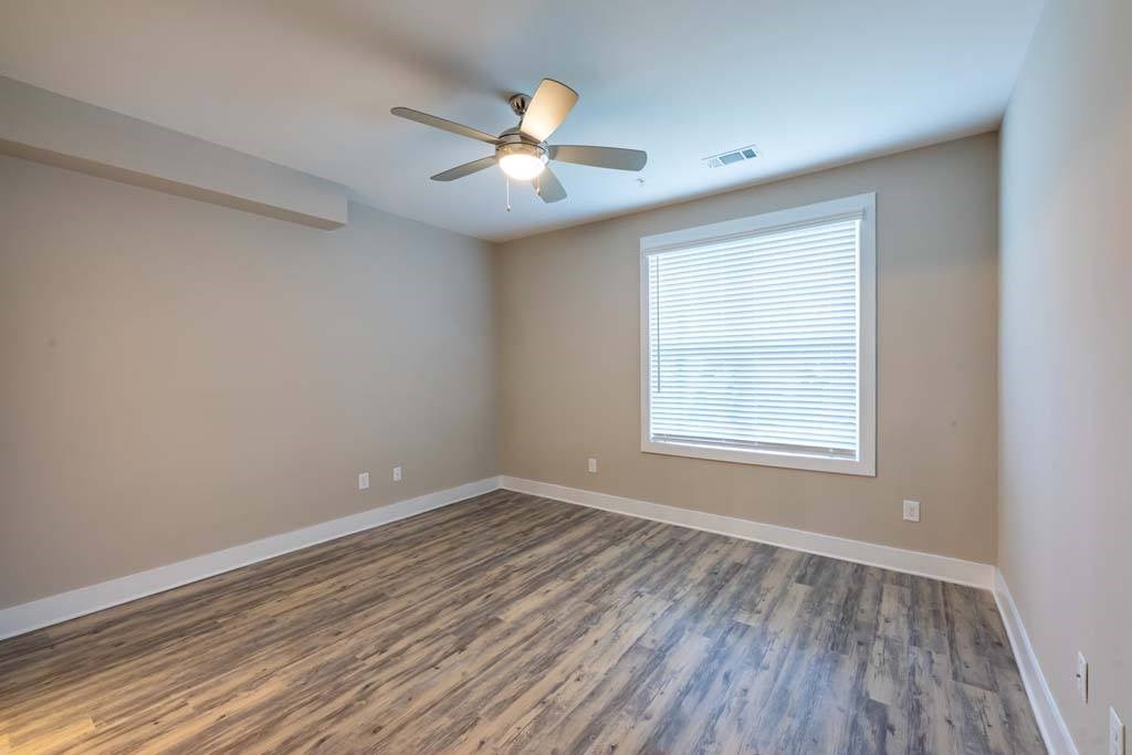 A room with a ceiling fan and a window with blinds at Foxwood Apartments, Raleigh-Durham, NC, 27616