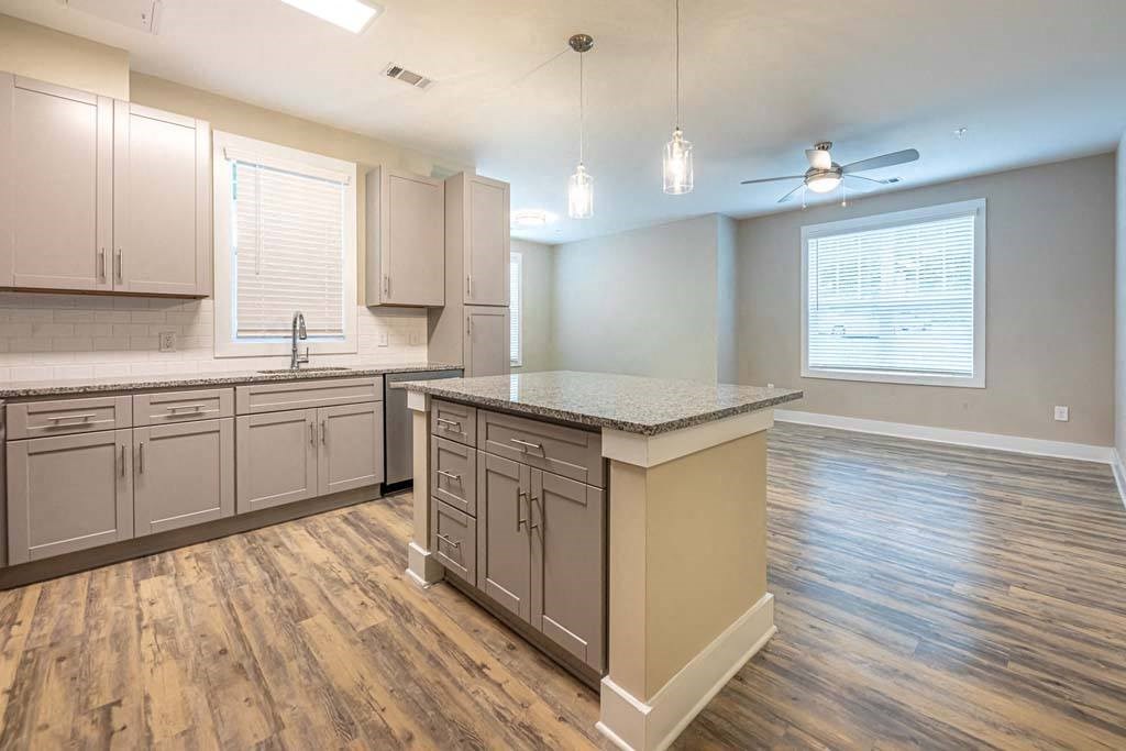 A kitchen with wooden floors and a countertop at Foxwood Apartments, North Carolina, 27616