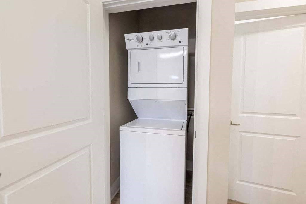 A white oven and stove top are in a small kitchen at Foxwood Apartments, Raleigh-Durham, NC