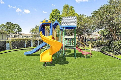 Playground with a yellow and blue slide.