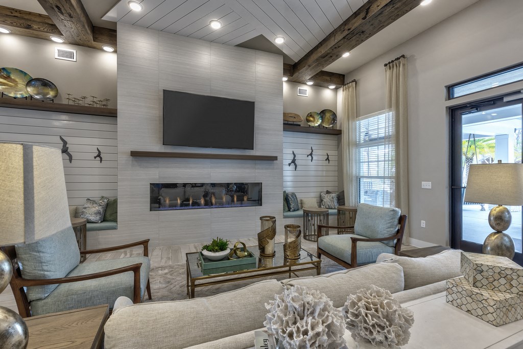 a living room with a fireplace and a television