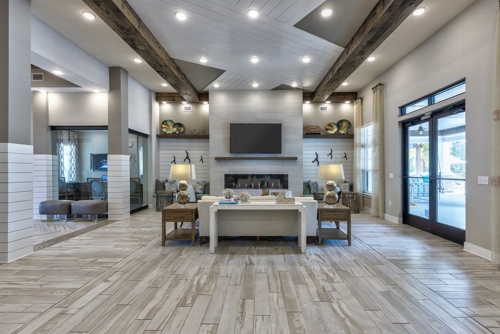 a large living room with a fireplace and a table
