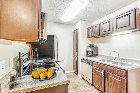 A kitchen with a stove top oven and a microwave.