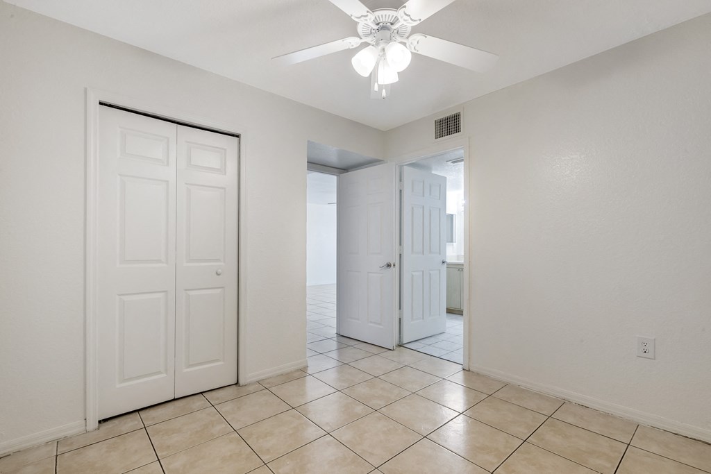 Room with Tiled Flooring, Window and Sliding Door Closet