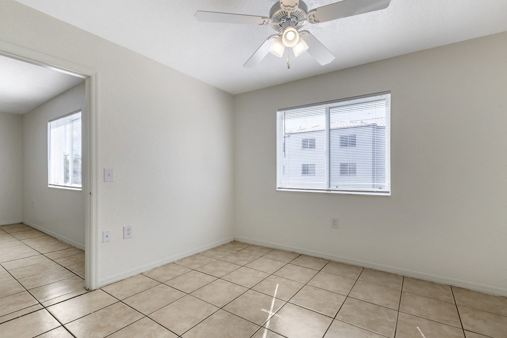 Tiled Room with Window and Ceiling Fan
