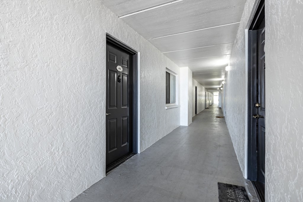 Apartment Breezeway with Doors and Doormats