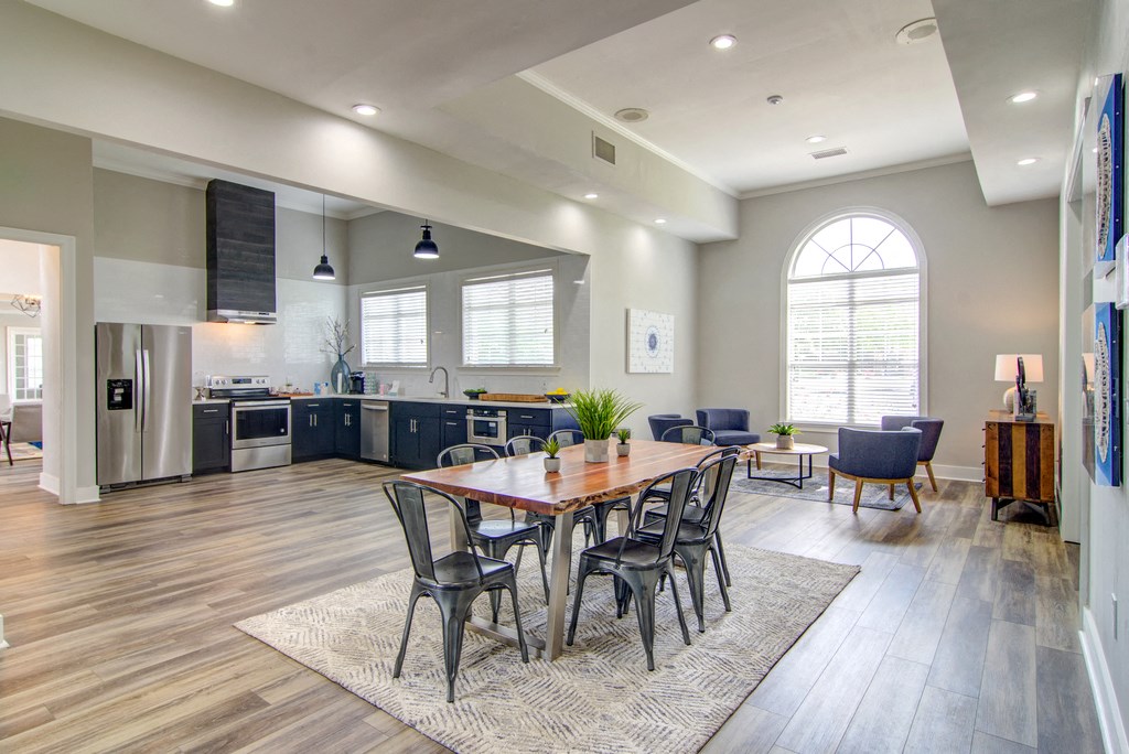 an open kitchen and dining room with a table and chairs