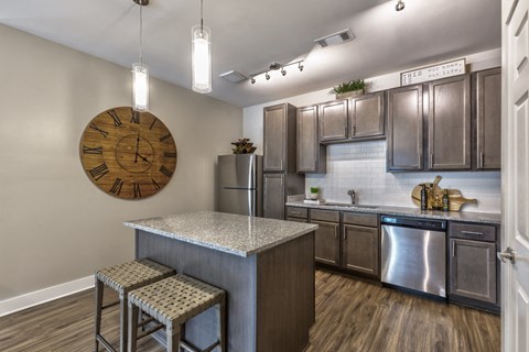 a kitchen with stainless steel appliances and granite counter tops