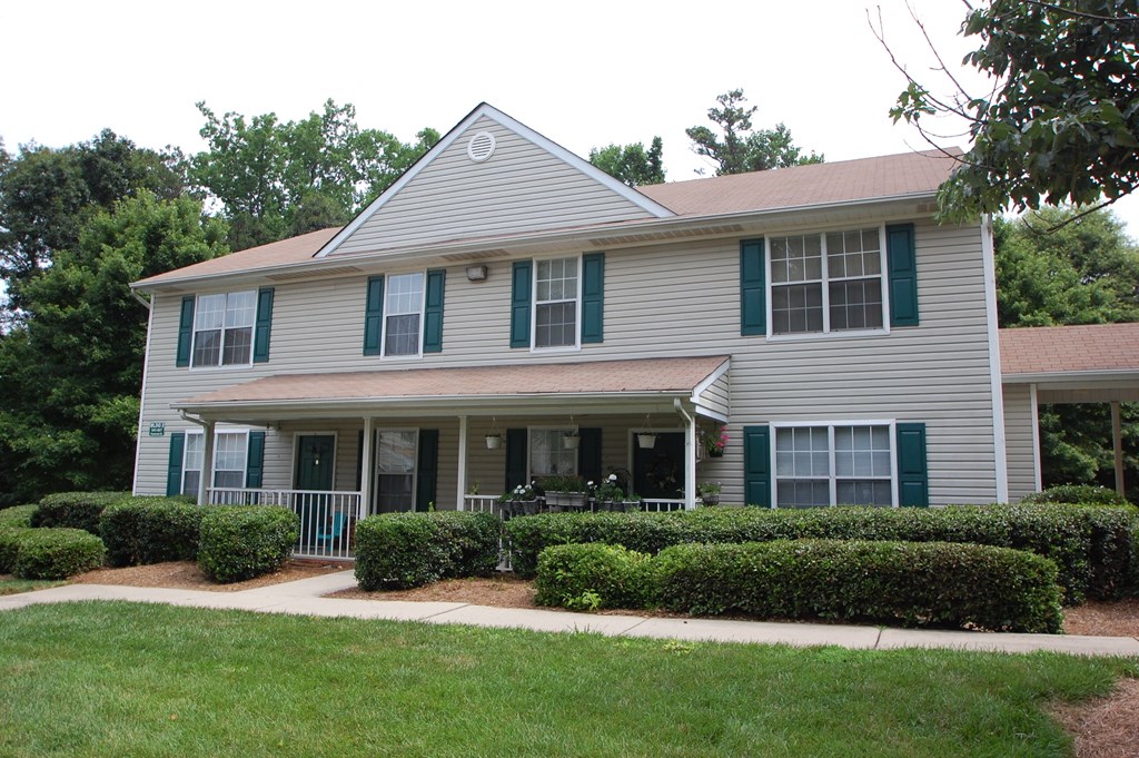 Building Exterior surrounded by shrubbery and trees