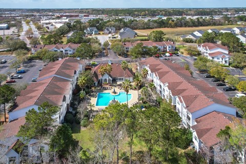 A bird's eye view of a resort with a swimming pool.