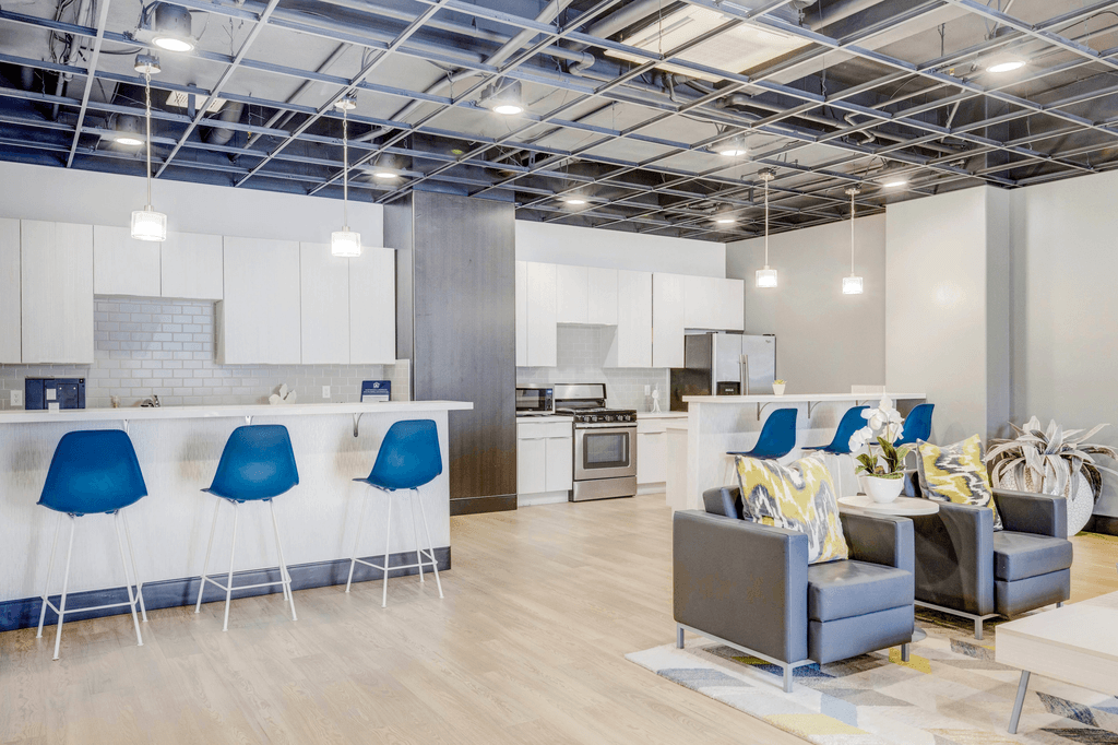 clubhouse lounge area with a kitchen