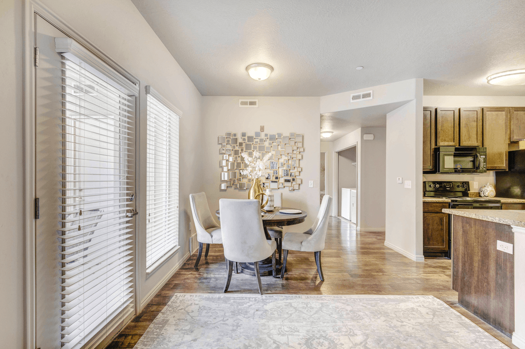 A dining room with a table and chairs is shown.