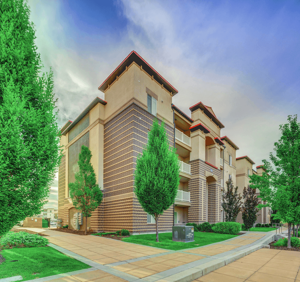 Building exterior with sidewalk and native landscaping