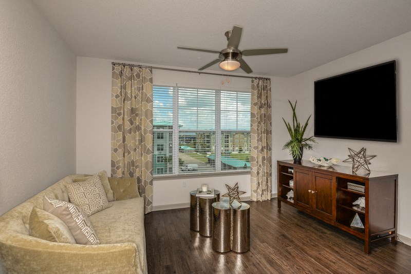 a living room with a couch and a tv