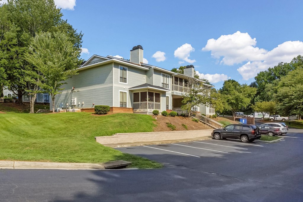 A large building with a parking lot in front of it. at Brandemere Apartment Homes, Winston Salem, 27106