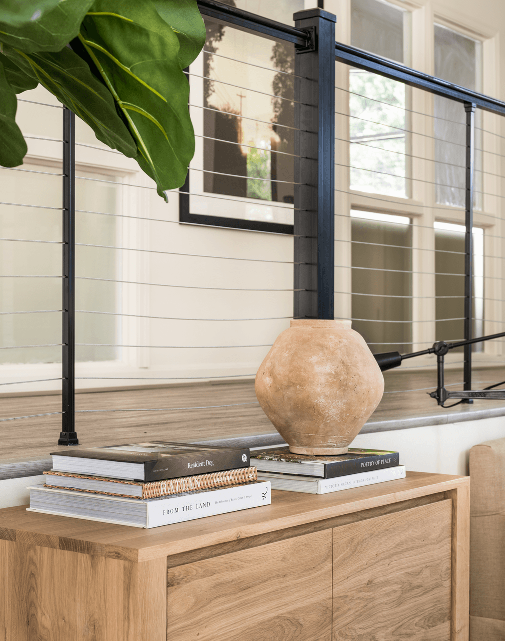 a table with books and a vase on top of it at Bridges at Mallard Creek Apartment Homes, Charlotte, 28269